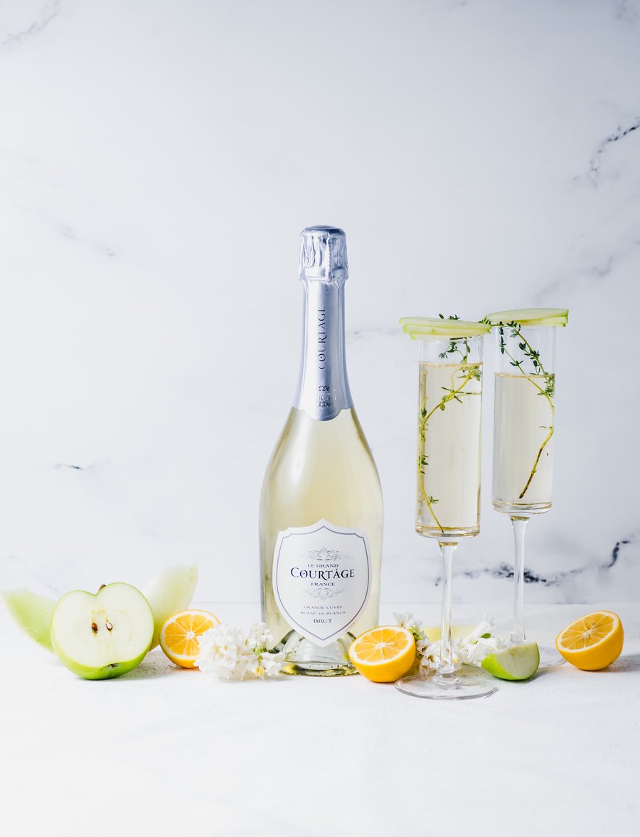 A bottle of Le Grand Courtage with some apples and lemons!