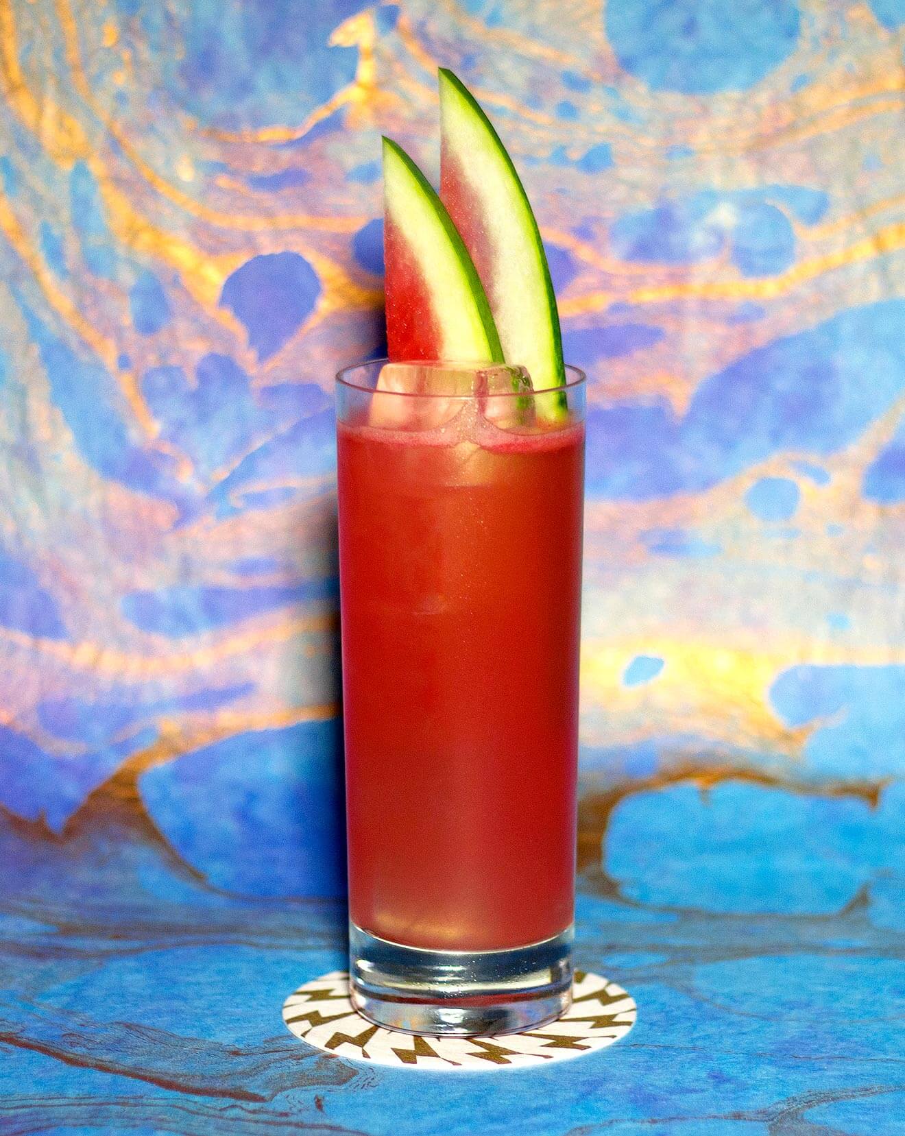 1000W Thumper, cocktail with abstract background, watermelon garnish