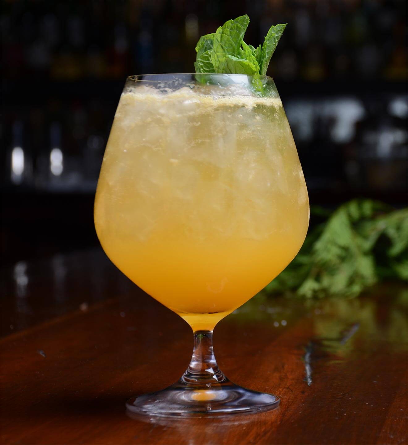 1886 Kami of Dawn cocktail with leaf garnish