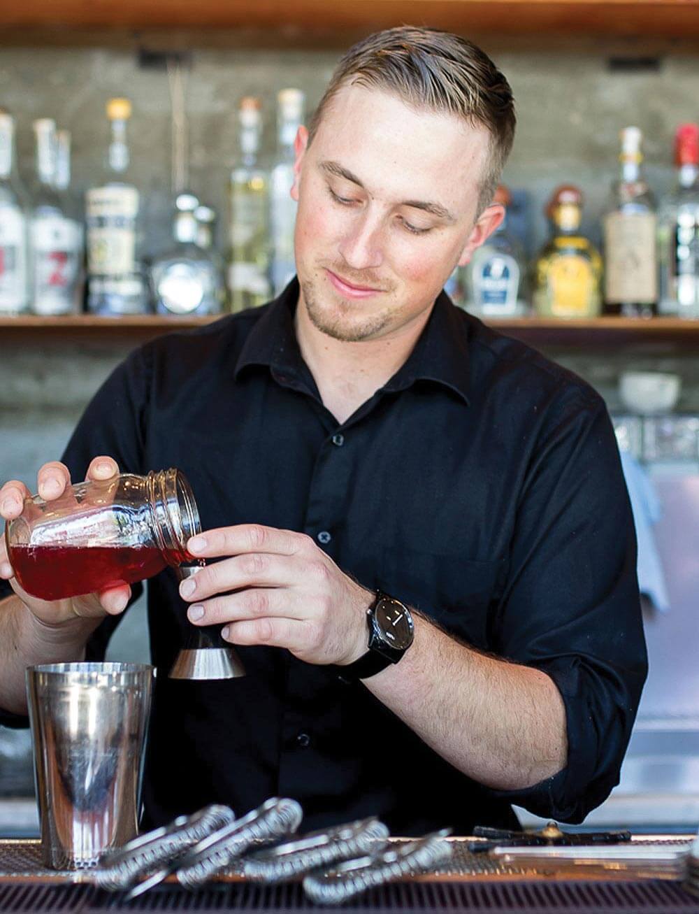 Alec Vlastnik, mixologist mixing cocktails