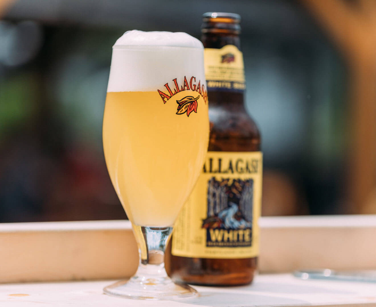 Allagash White, glass and bottle on wood table