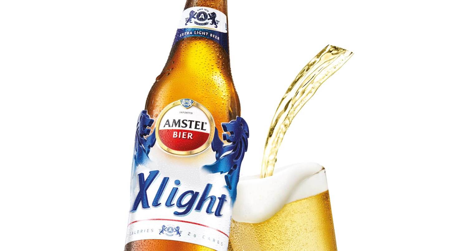 Amstel Xlight, bottle and glass on white, featured image