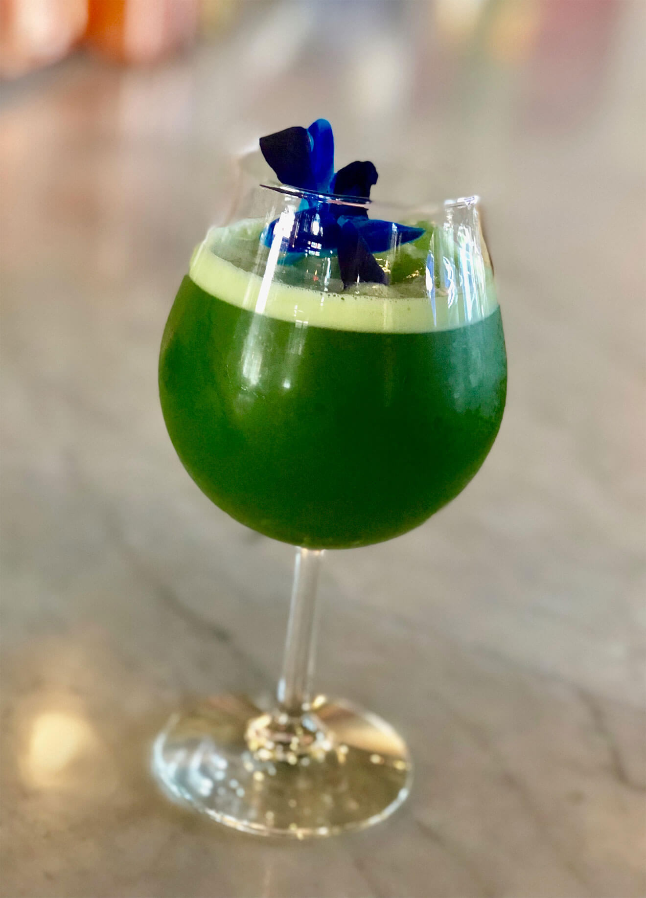 BAAR BAAR Sour green cocktail with edible flower