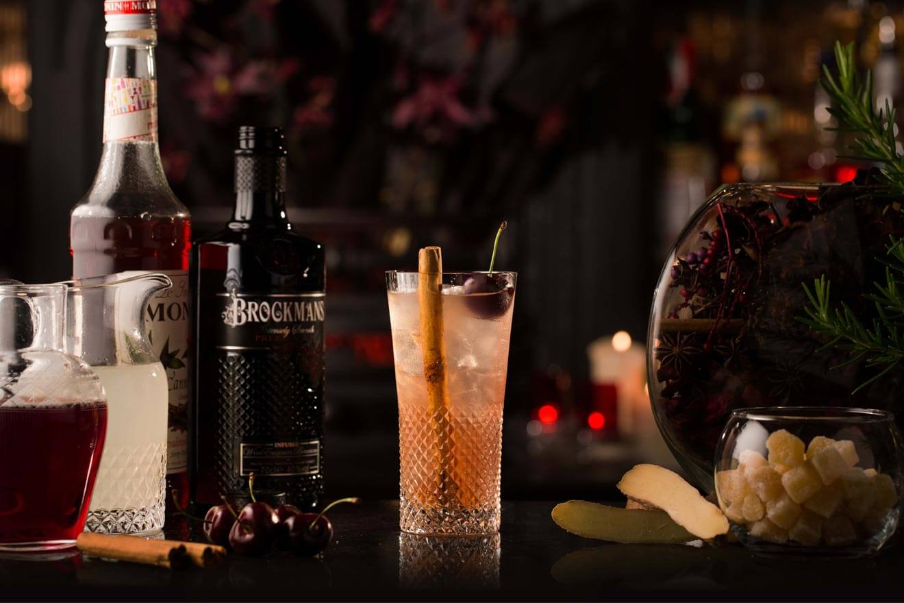 Brockmans Fiery Side, cocktail with bottle, garnish background