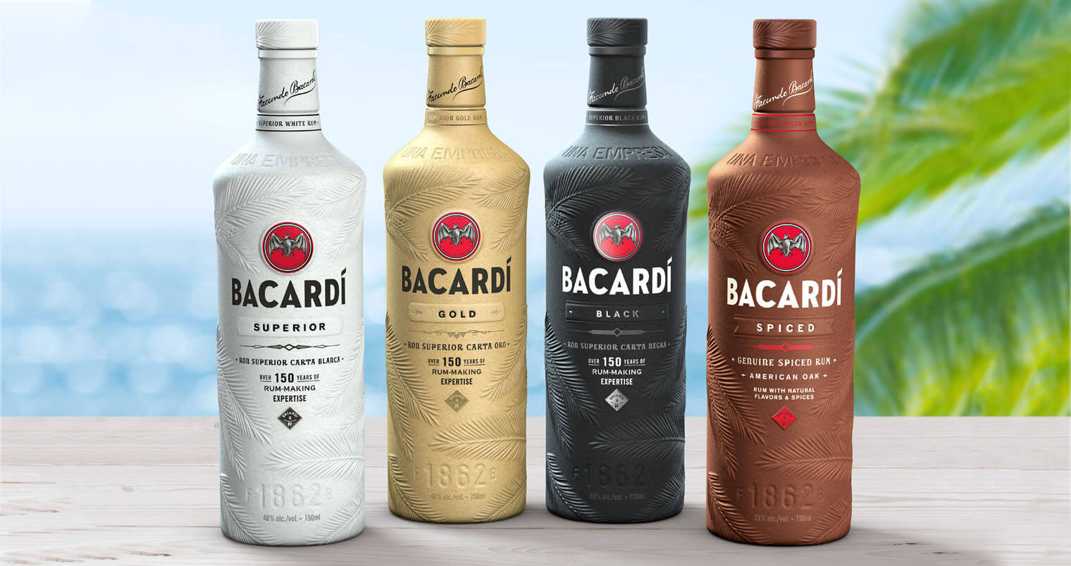 Bacardi Innovative Paper Bottles Lineup, bottles on bar, tropical beach, featured image