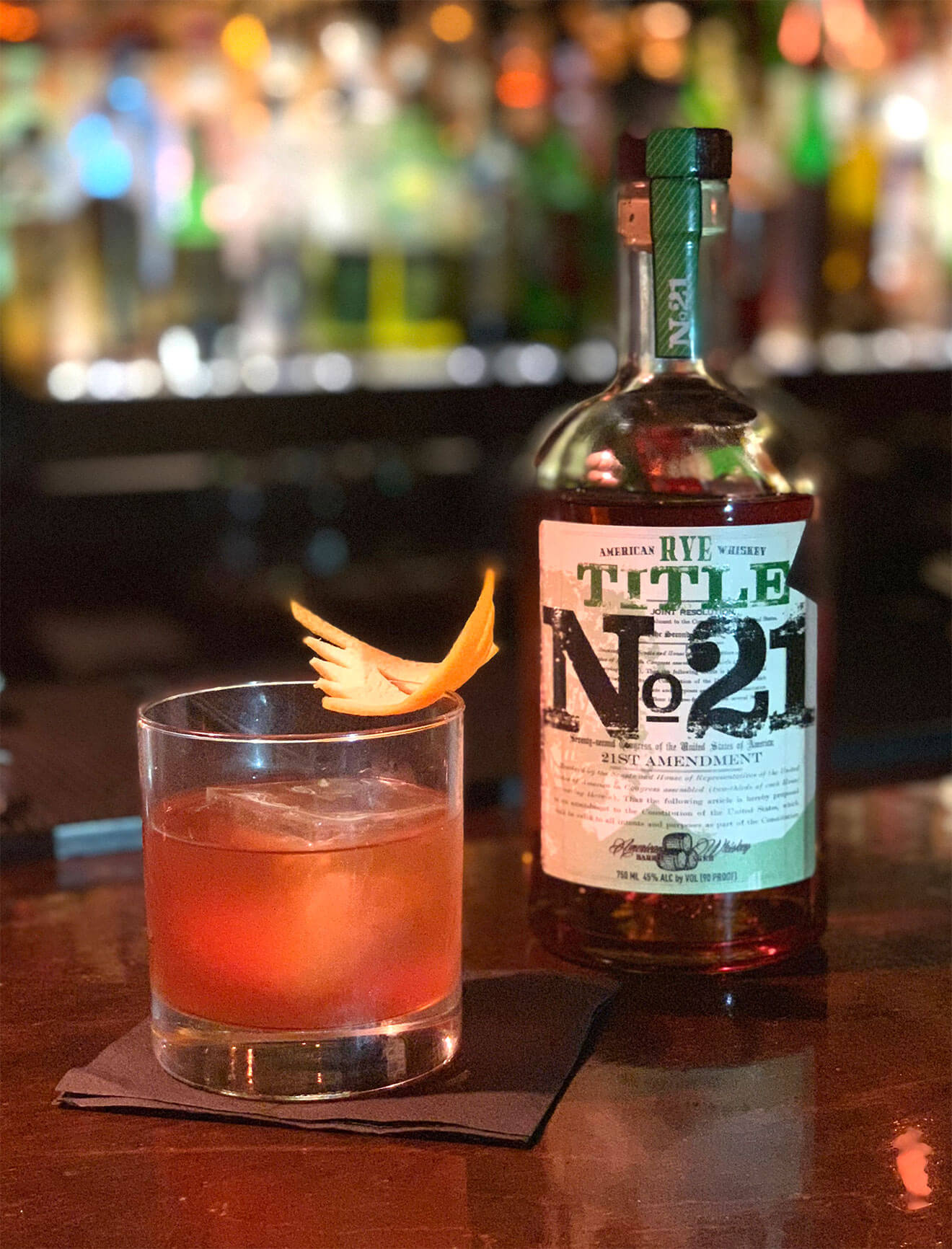 Back Alley Old Fashioned, bottle and cocktail with garnish