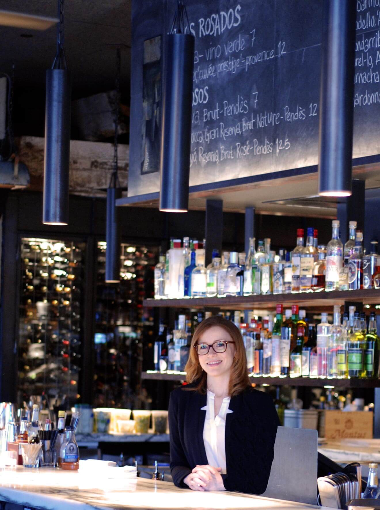 Gretchen Thomas behind the bar