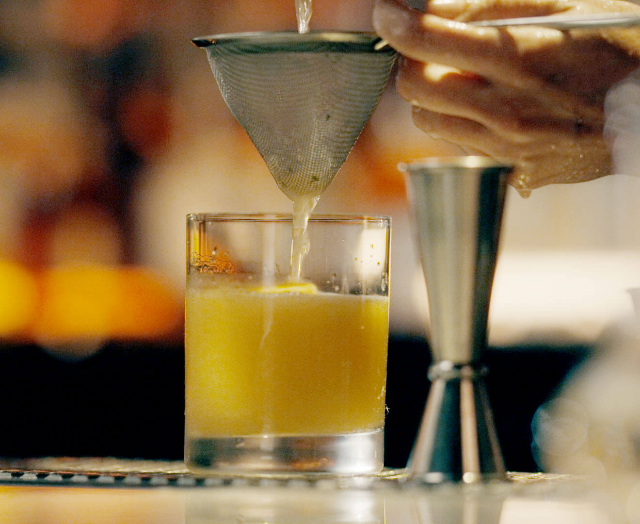 Bartender mixes drinks at New York's Death & Co