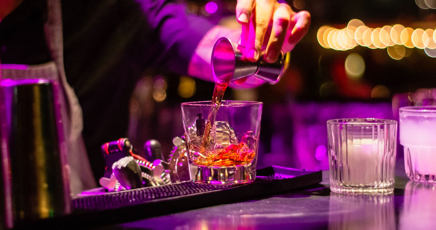 Bartender mixing a drink, featured image