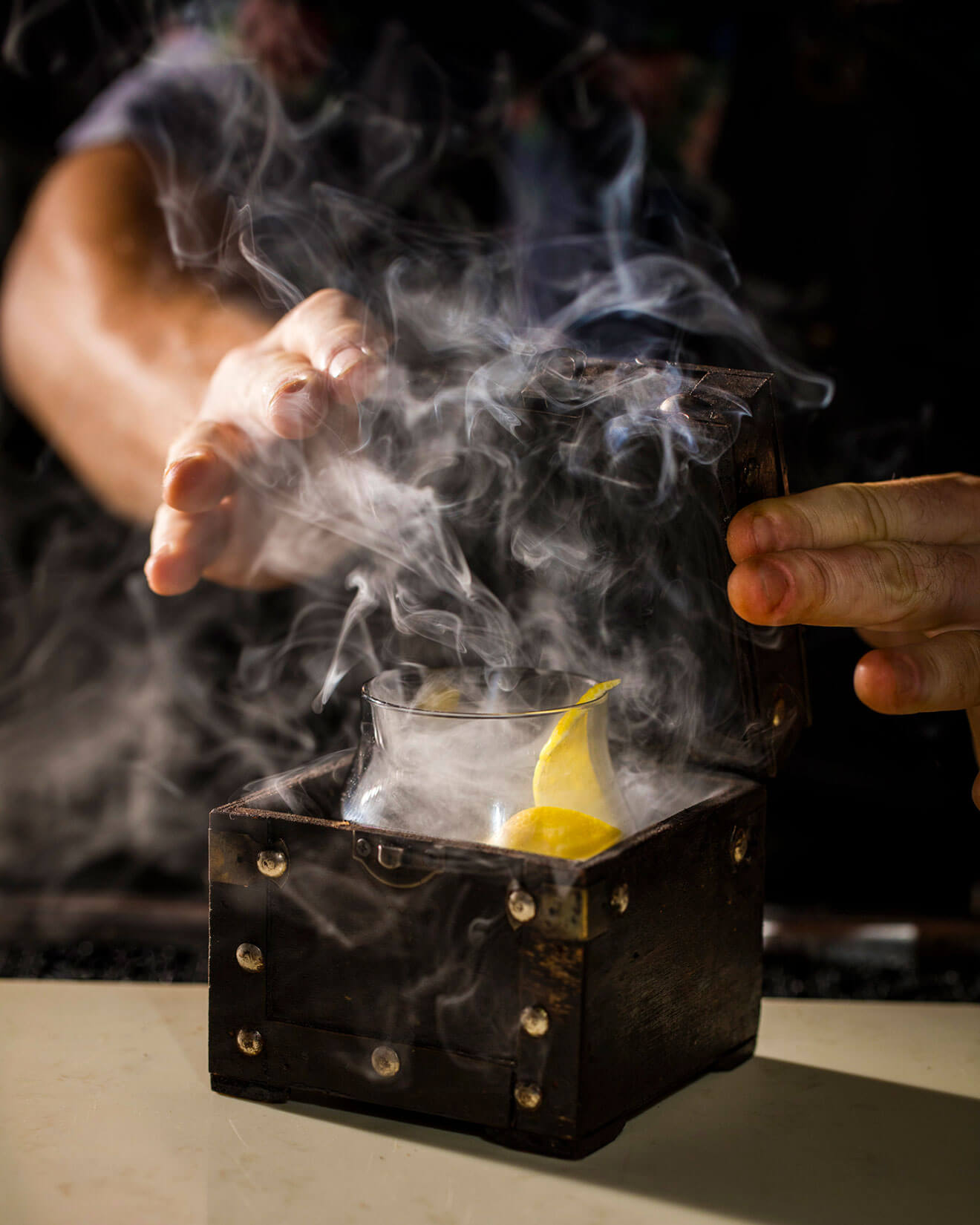 The Black Pearl cocktail with smoking garnish