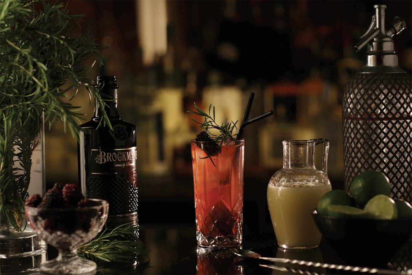 Blackberry Sling, brockmans bottle, garnishes and bar tools