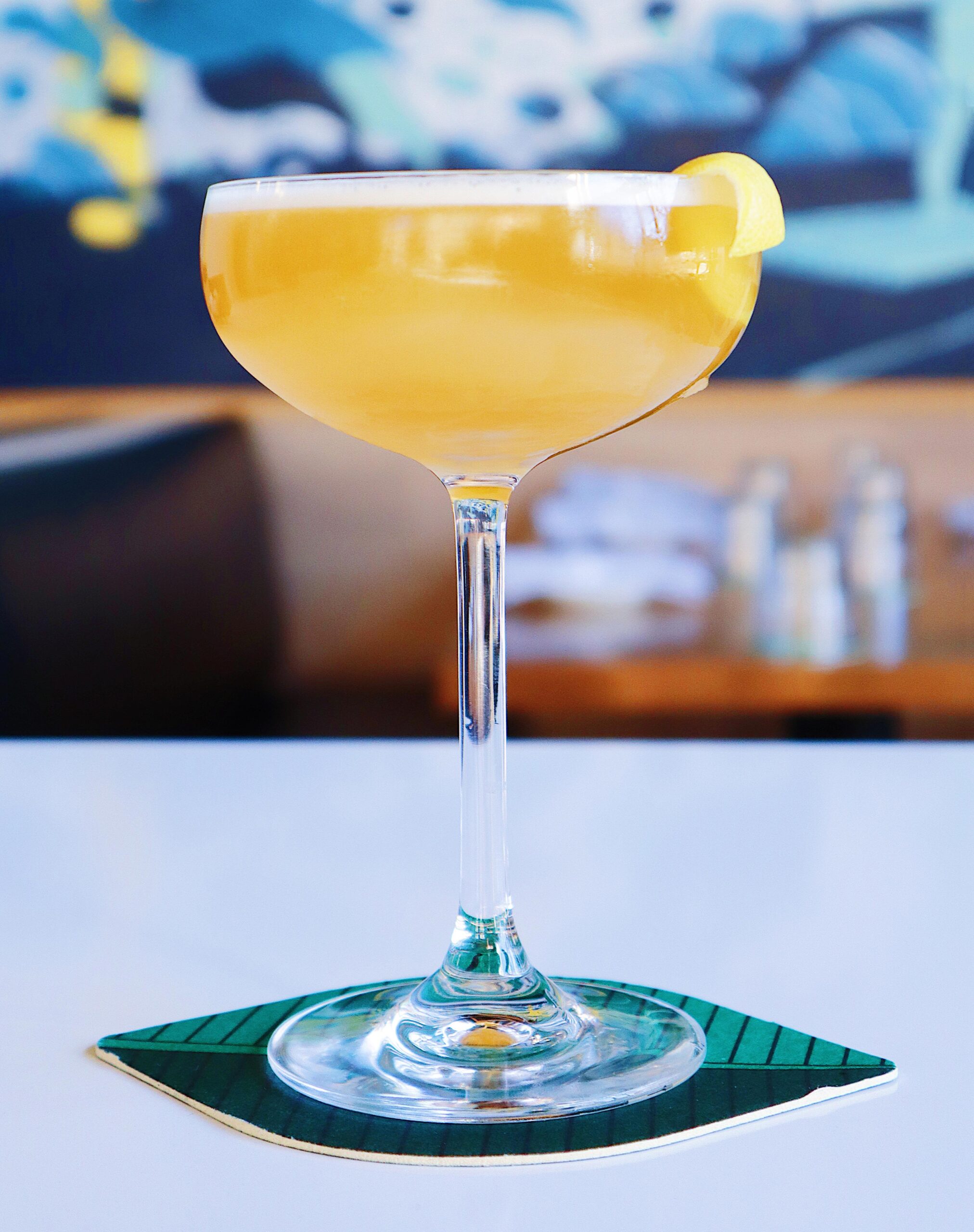 Brandy Apple Punch, cocktail with garnish on cocktail napkin