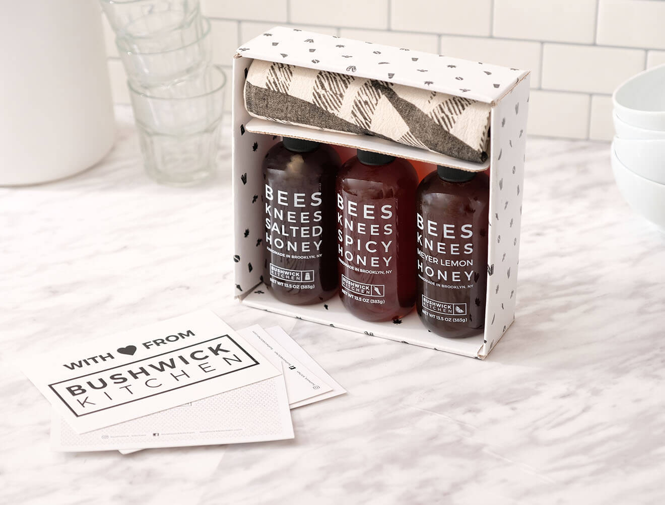 Bushwick Kitchen Condiments, packaging and bottles on marble