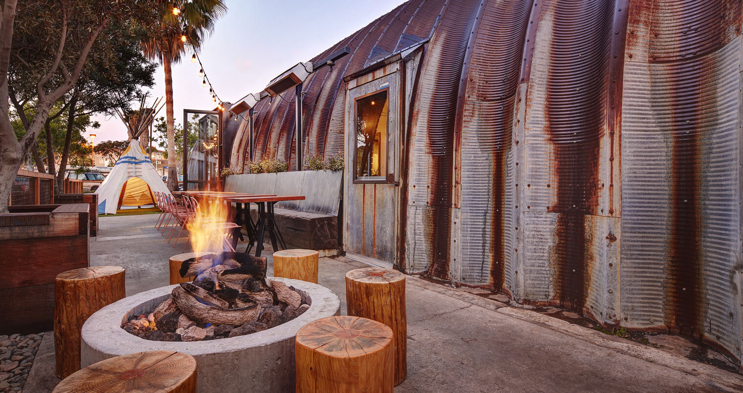 Campfire Exterior, firepit, tp and seating, featured image