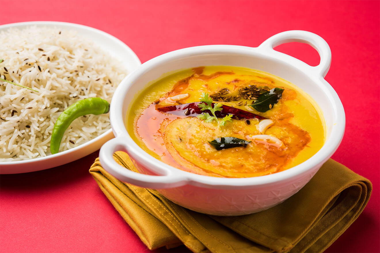 Chana Dahl, vegan dish, vibrant background, bowl of rice