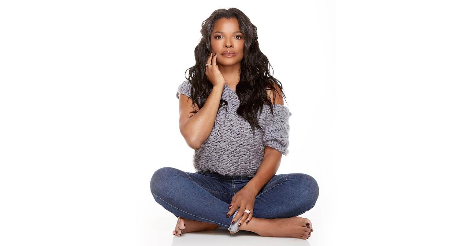 Chillin' with Keesha Sharp, face in hand, sitting, on white, featured image