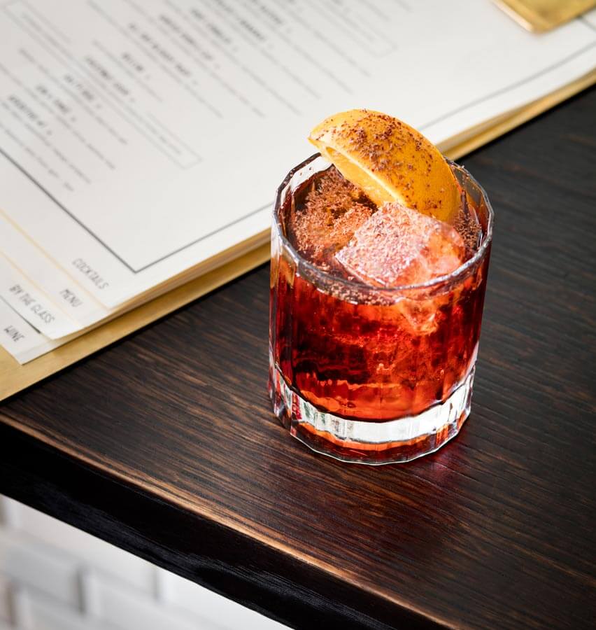 Chocolate Negroni cocktail with garnish