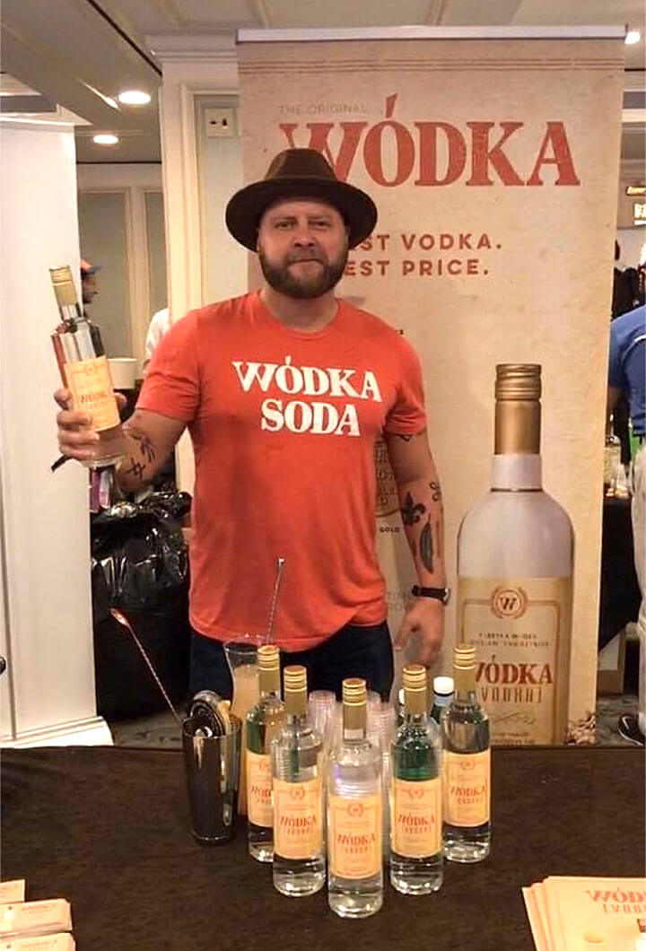 Daniel Undhammer with Wódka Vodka bottle and backdrop