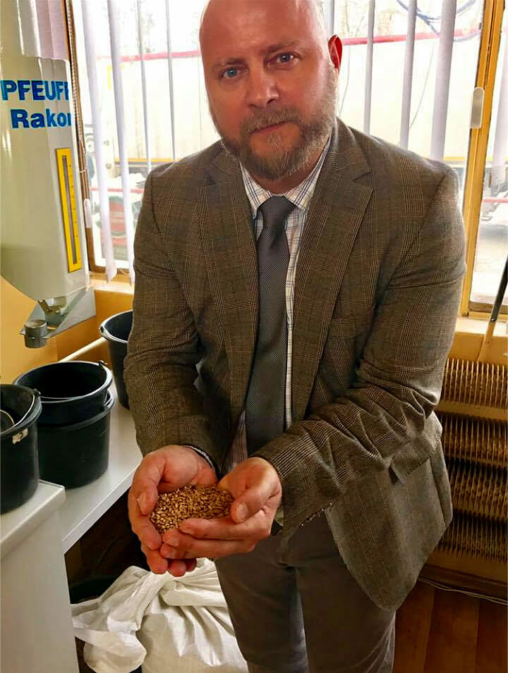 Daniel Undhammar of Wódka Vodka holding grains