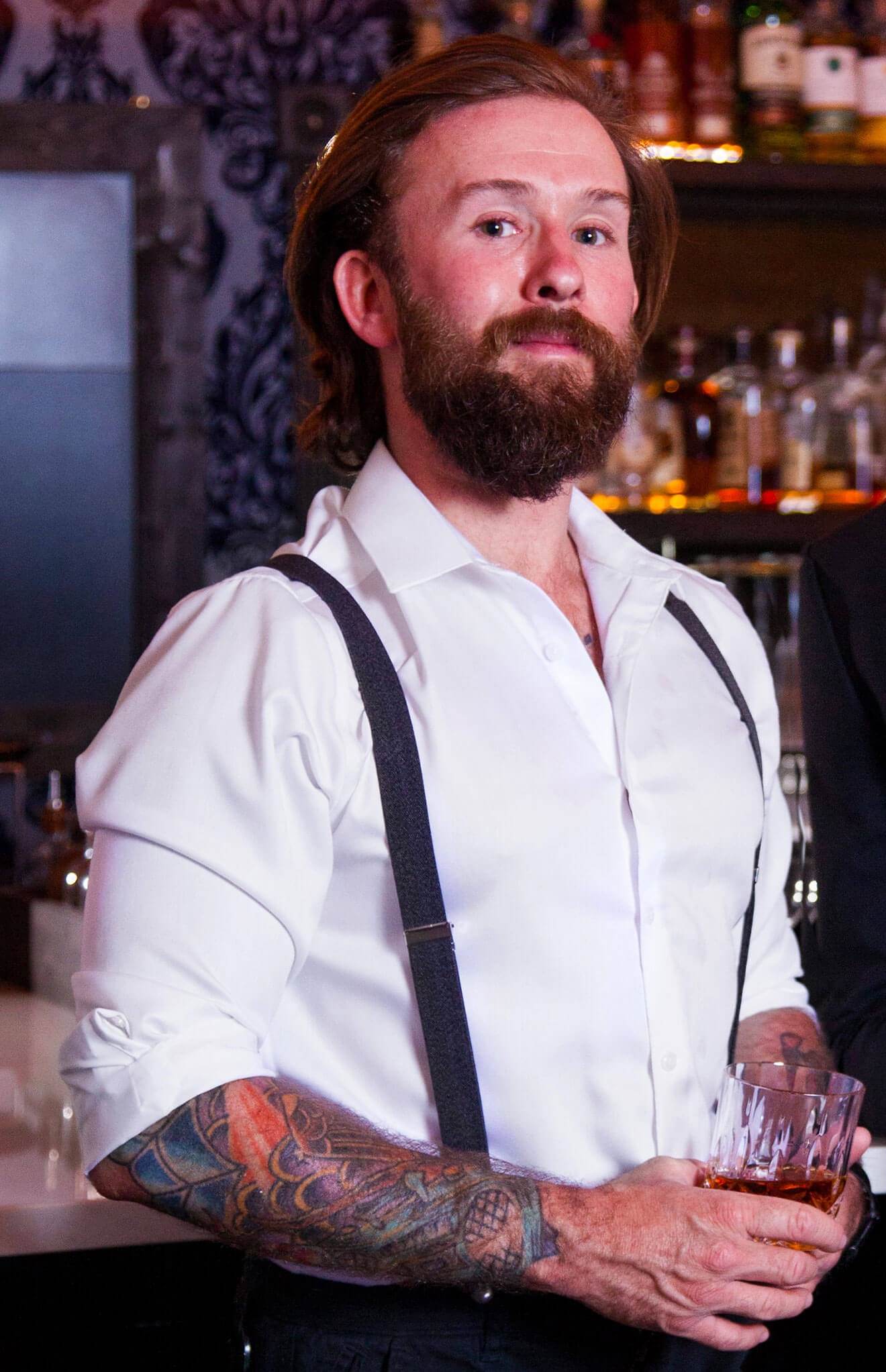 Dennis Gobis in white shirt and suspenders