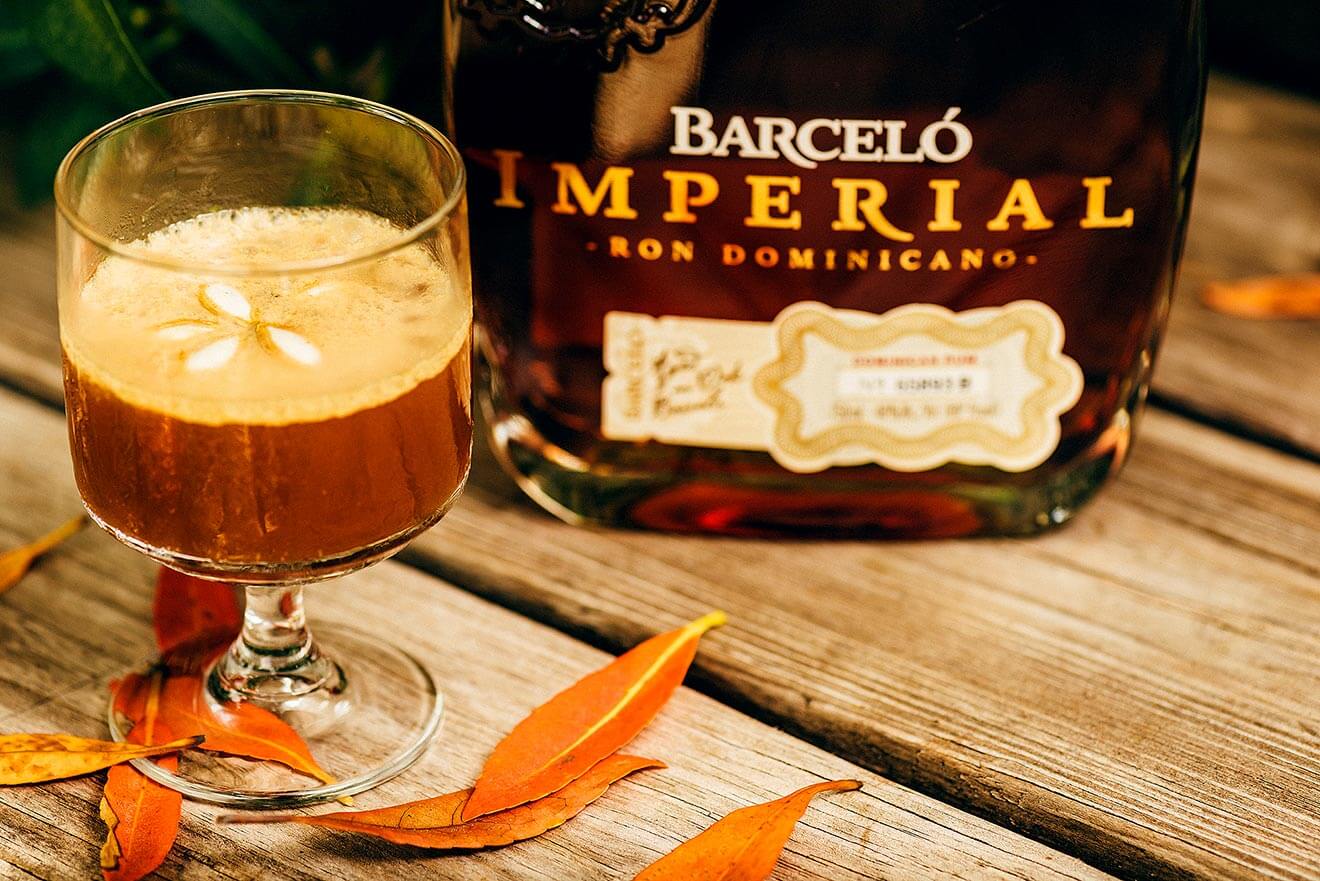 Don't Fall on Me, cocktail and bottle with garnish on table