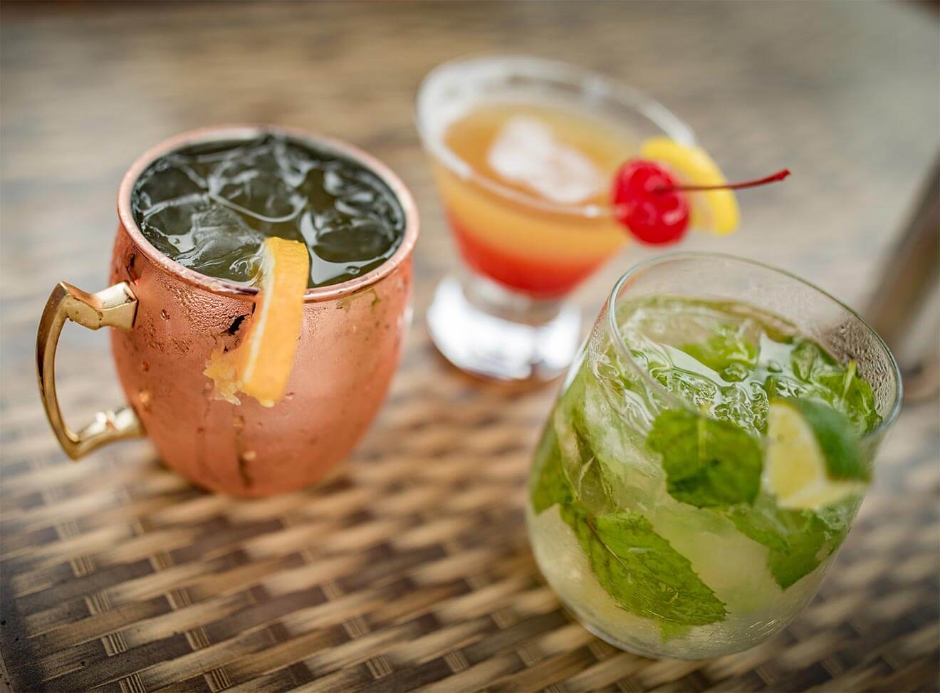 Door County Brewing Company Cocktails with garnish on wicker table