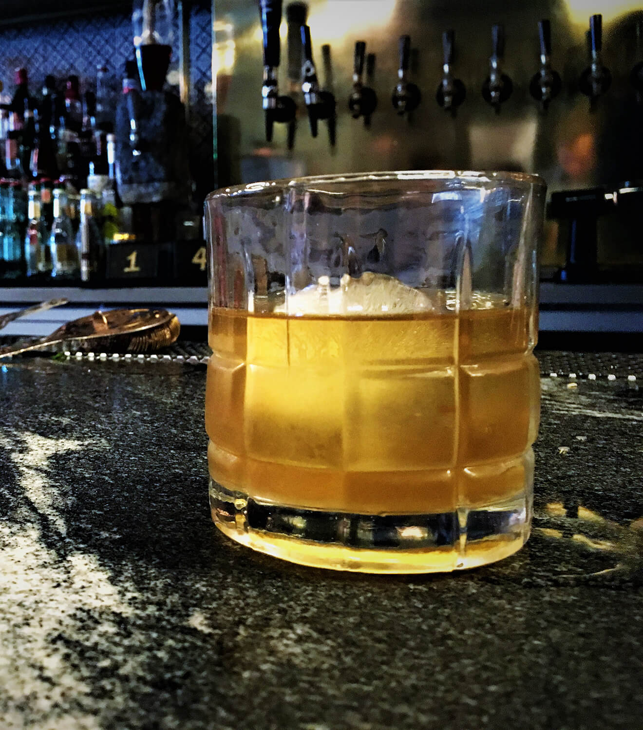 Double Smoked Old Fashioned cocktail on bar