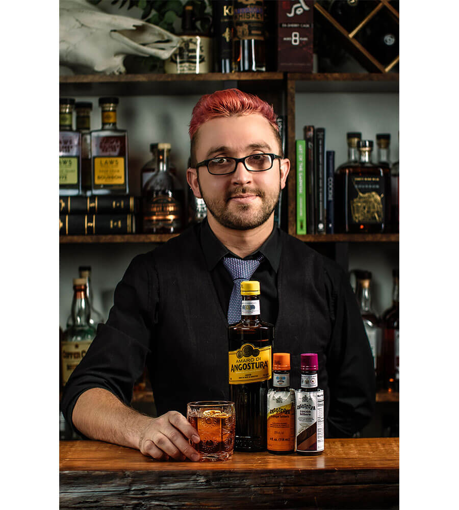 Evren Bora, pouring a cocktail