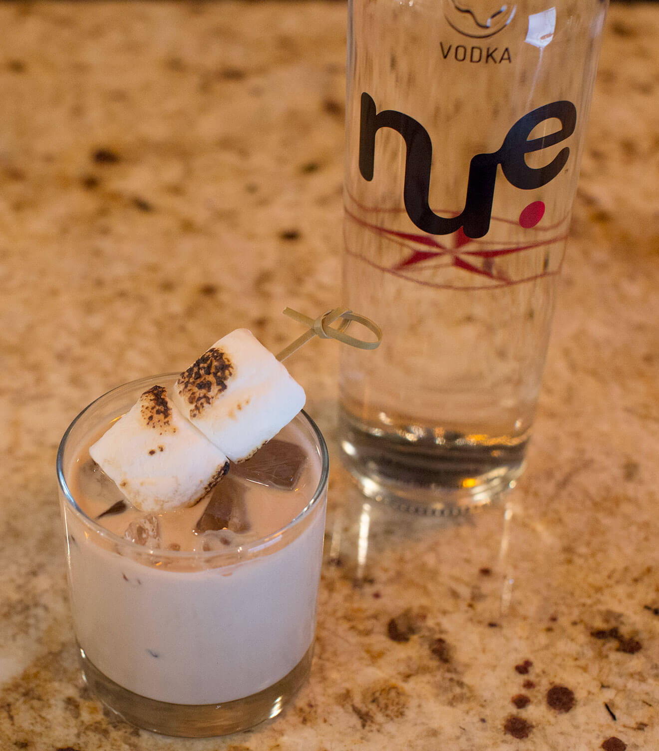 Feliz Nuevidad cocktail and bottle