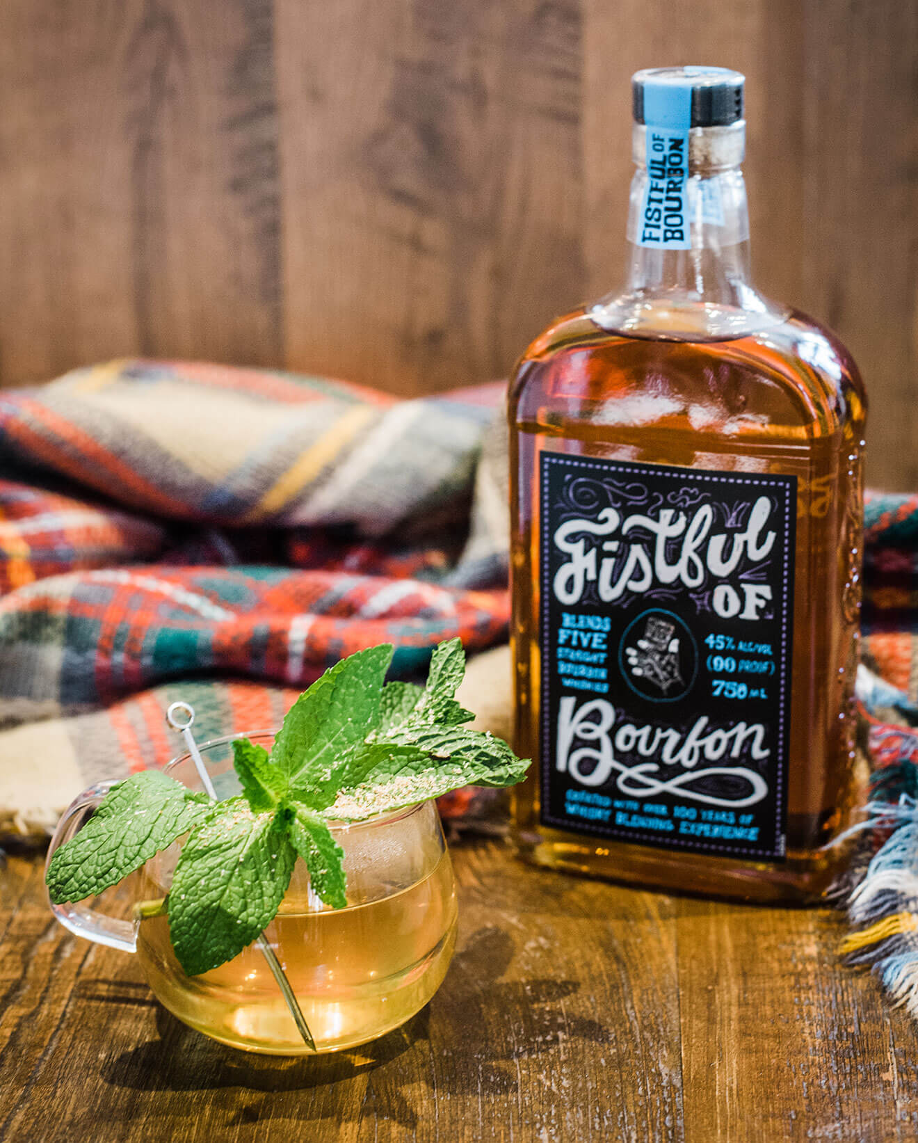 Fistful of Bourbon Hot Toddy, bottle with cocktail, garnish