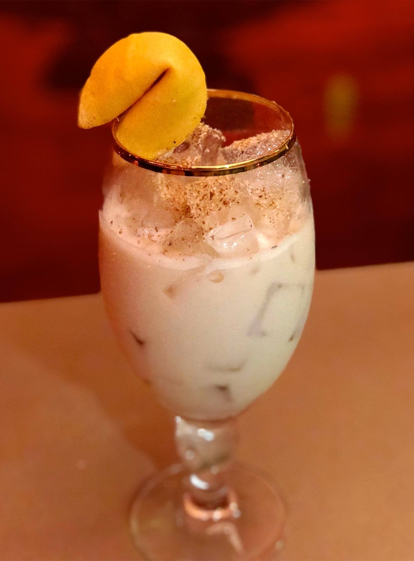 Fortune Cookie Milk Punch, cocktail with fortune cookie garnish
