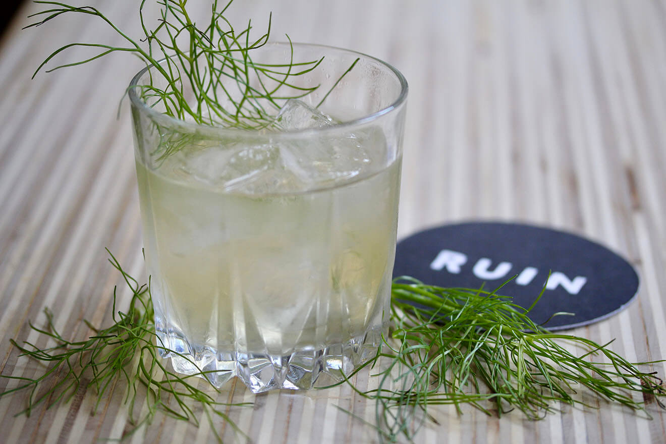 Hatchback cocktail with herb garnish