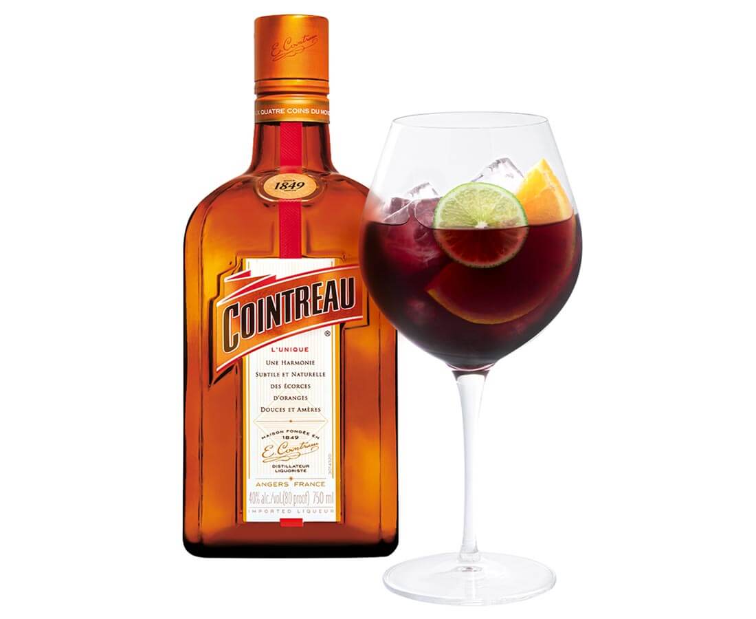 Holiday Sangria, cocktail and bottle on white