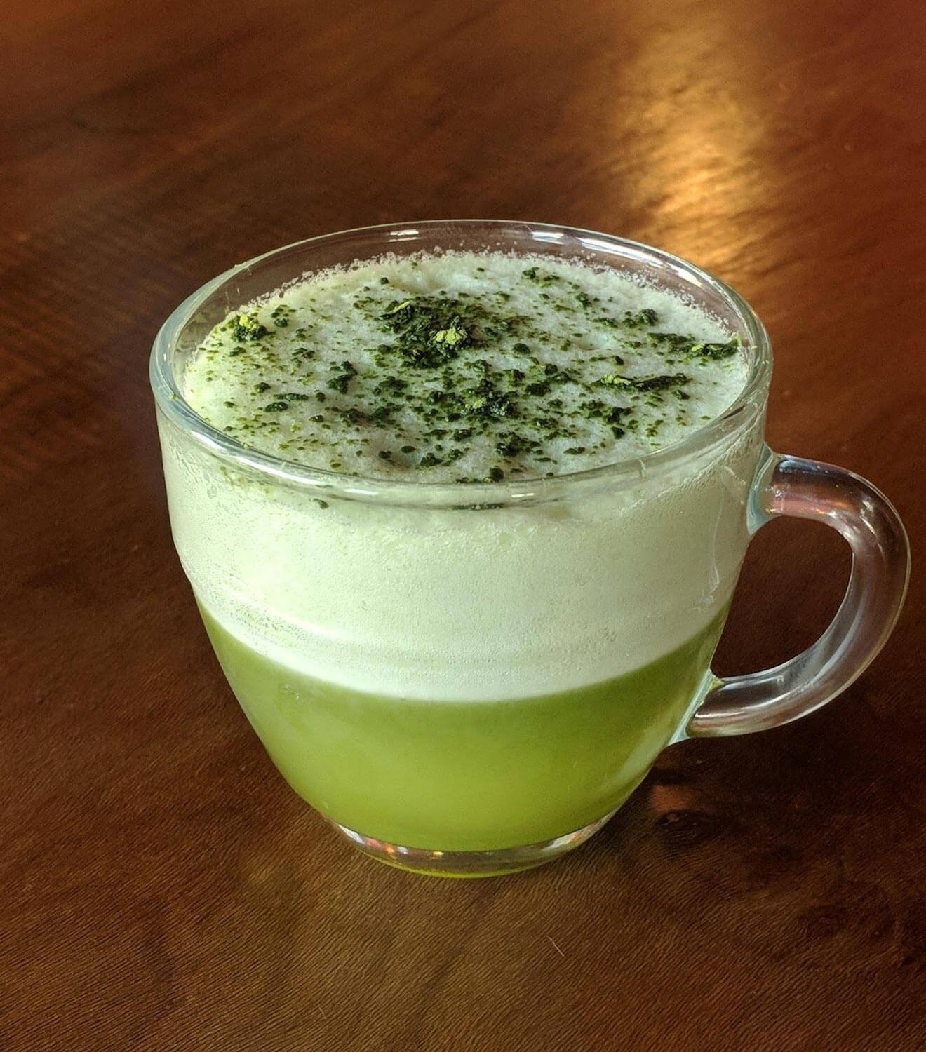 Honey, Don’t Dew Me Like That cocktail on wooden bartop