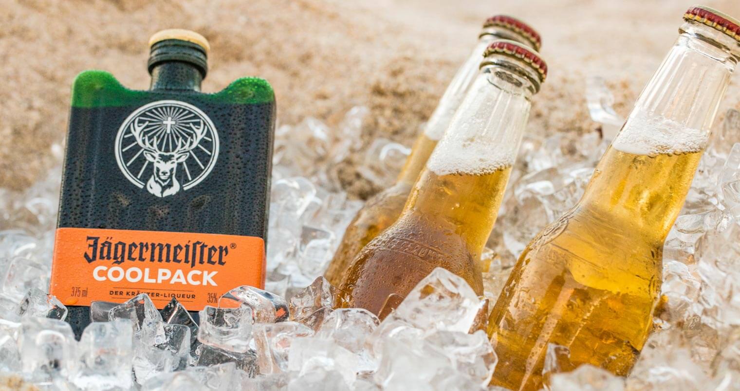 Jägermeister Coolpack, bottles and plastic glass in cooler with ice, featured image