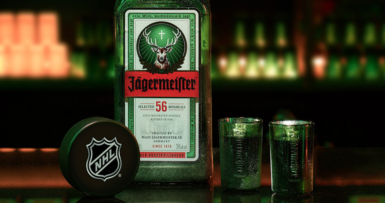 Jägermeister-and-NHL-Announce-Partnership, bottle and shots on the bar, featured image