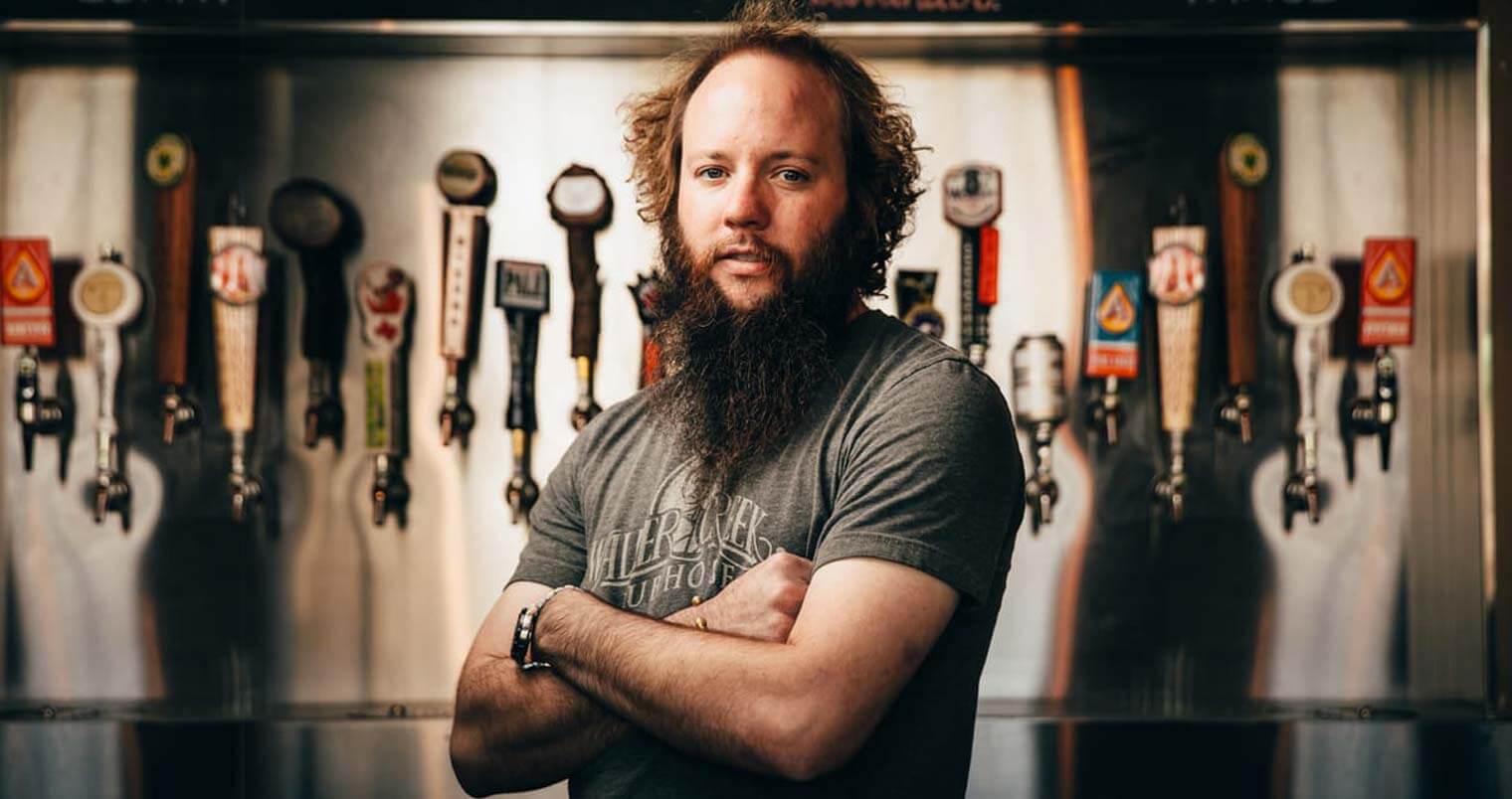 Justin Malone, serious with bar taps, featured image