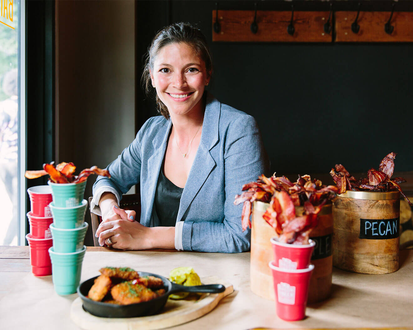 Kate Levenstien, at table smiling