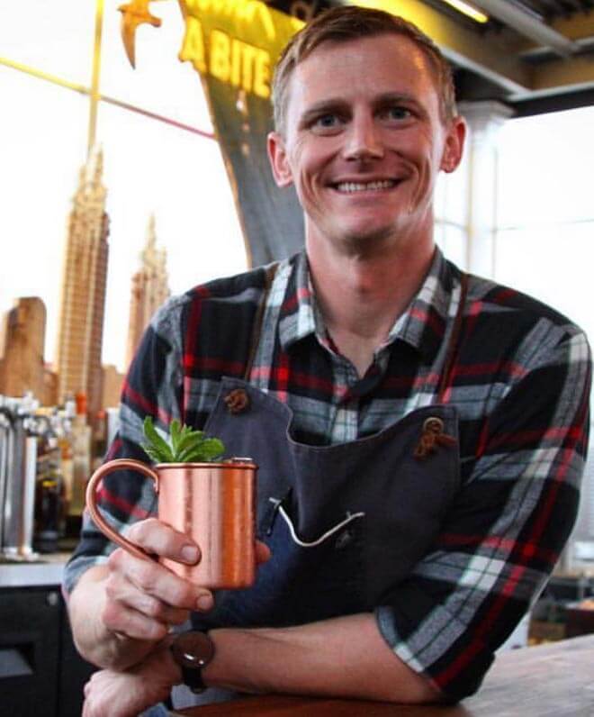 Lee Caldwell of Avanti, portrait with cocktail in hand