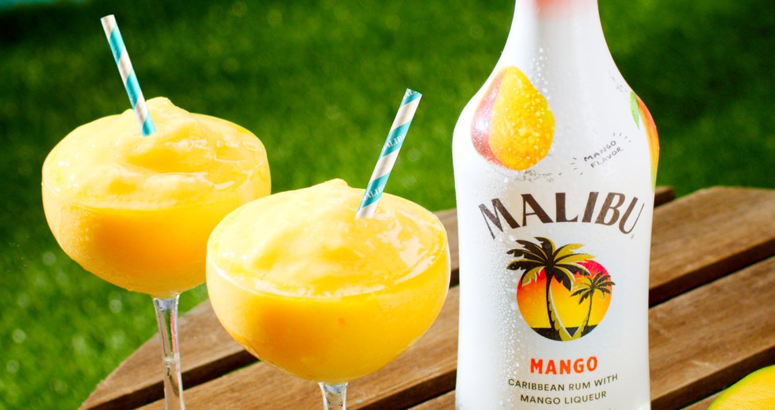 Malibu Mango Frozen Daiquiri, frozen cocktail with bottle, wooden round table, featured image