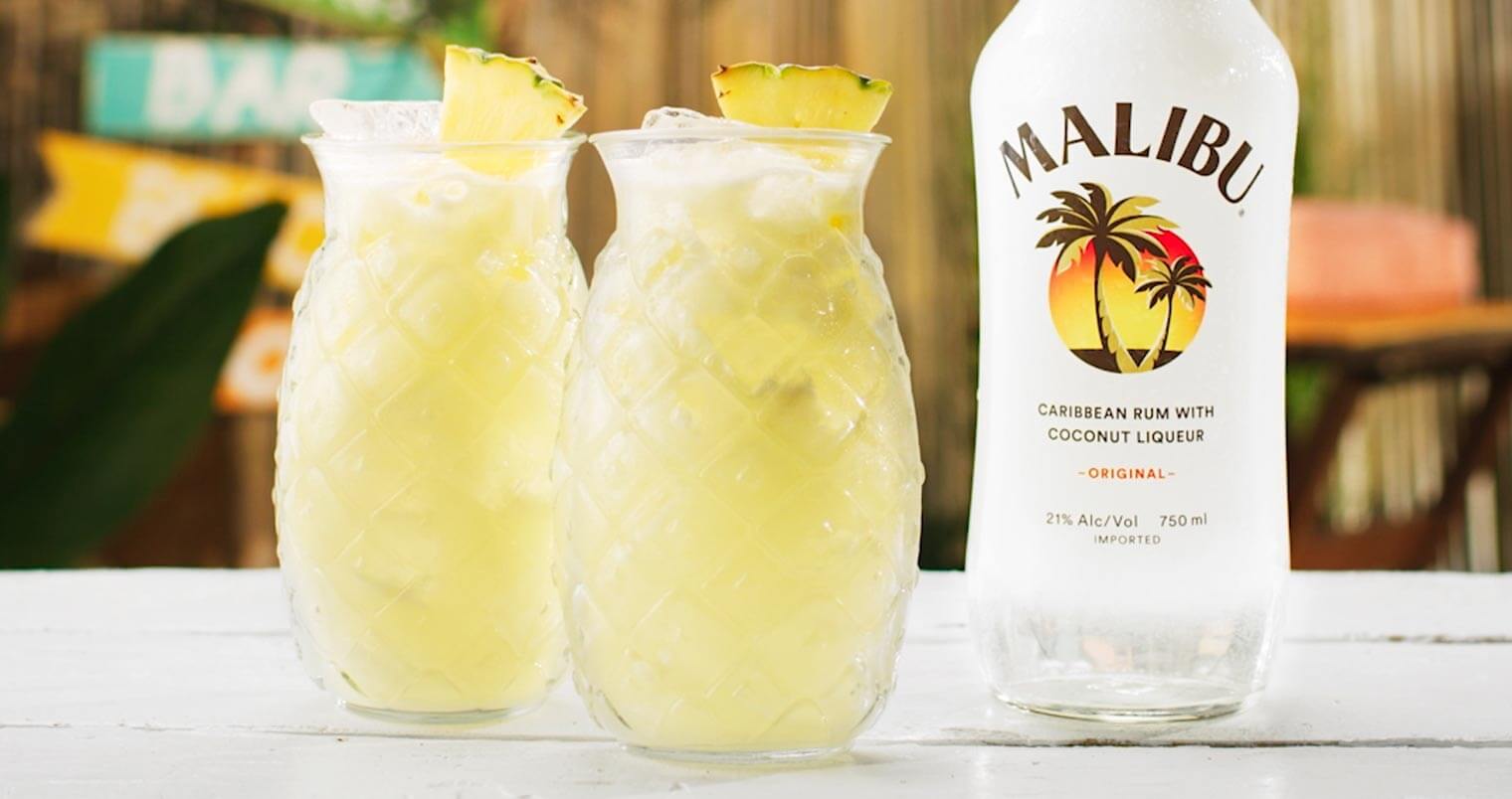 Malibu Piña Colada cocktails with bottle, featured image