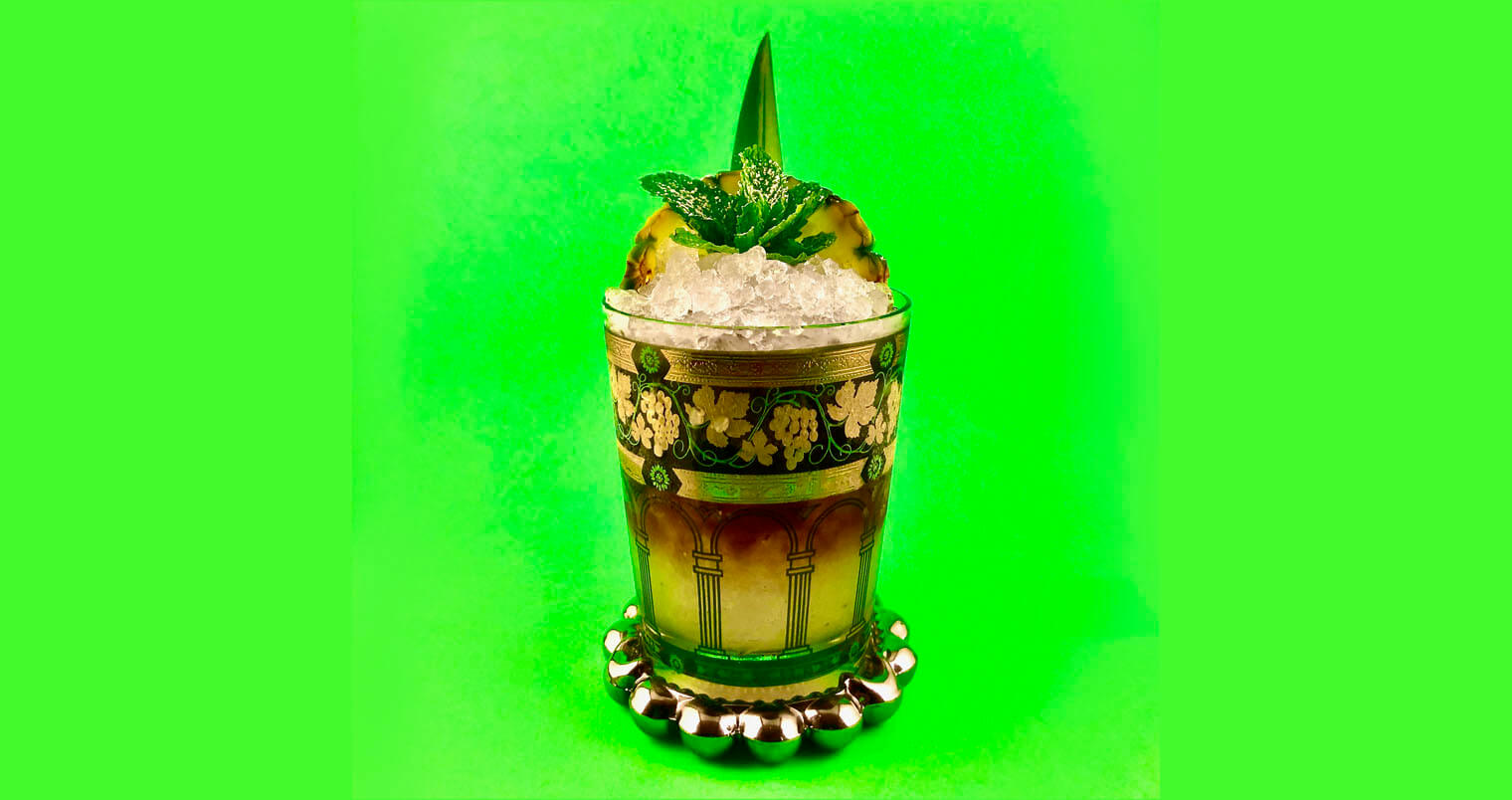 Trick Pot Cobbler, garnished cocktail, green background, featured image