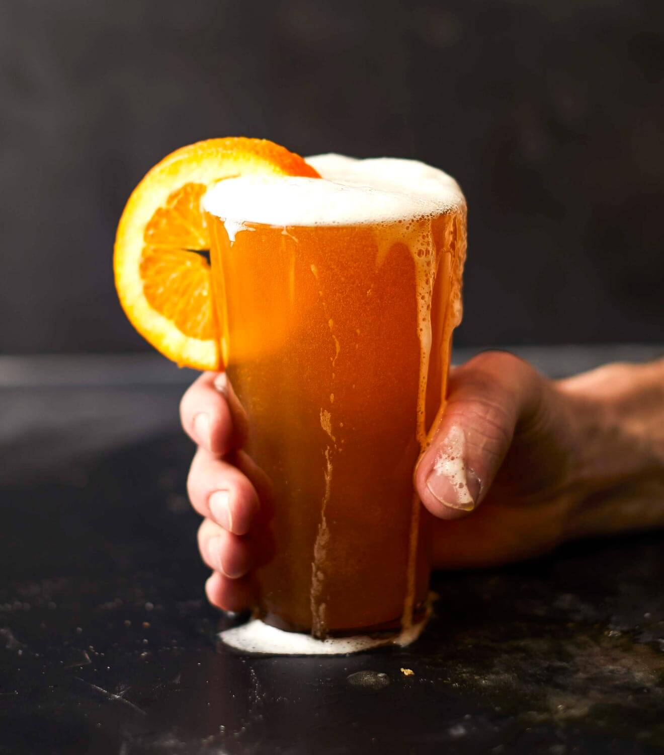 Makeready Libations & Liberation, pint with orange slice