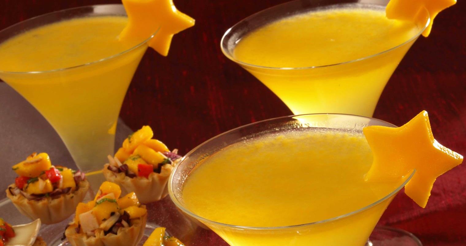 Mango Bellini cocktails with star mango garnish, featured image