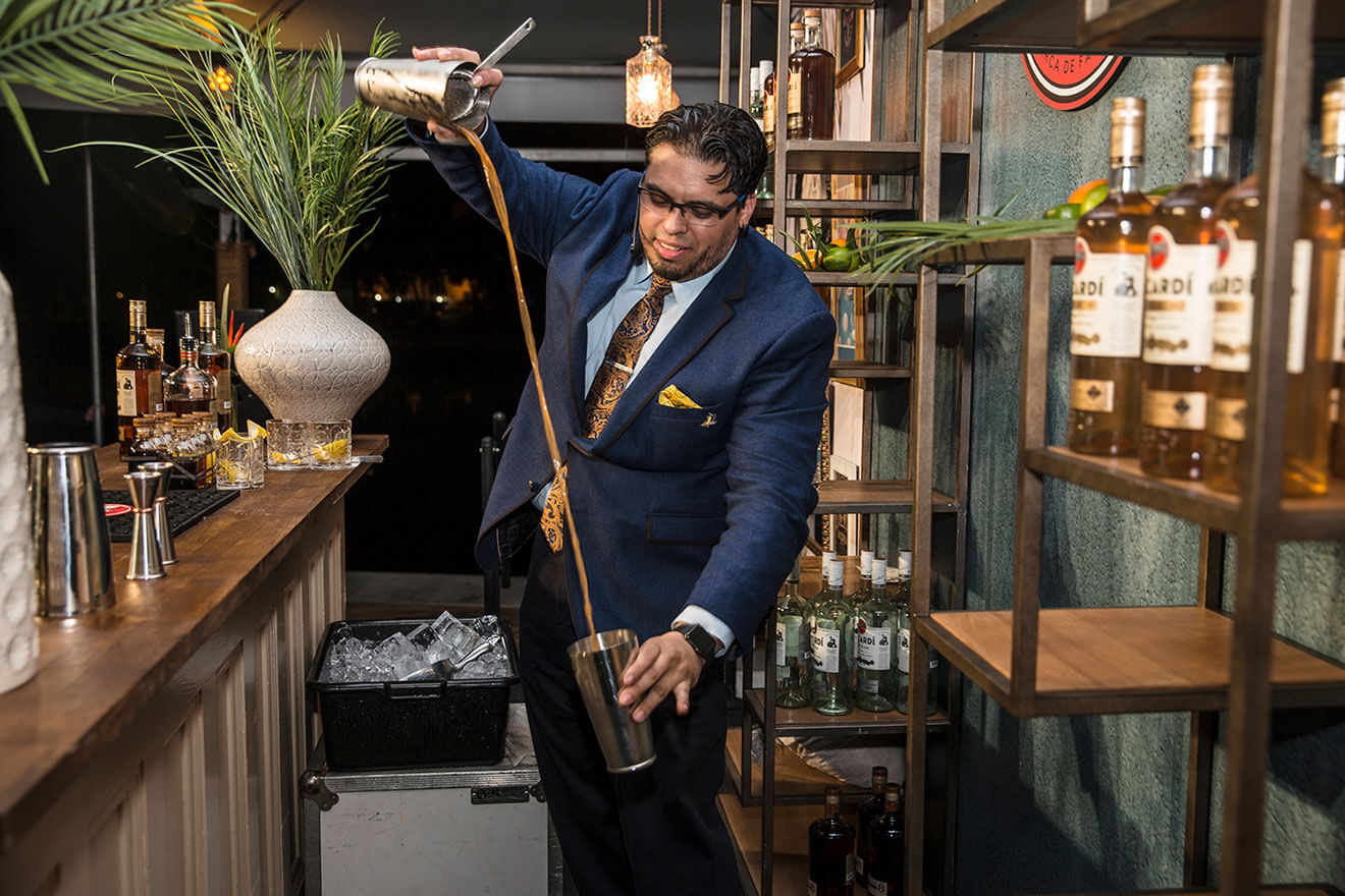 Moe Isaza Pouring His Cocktail