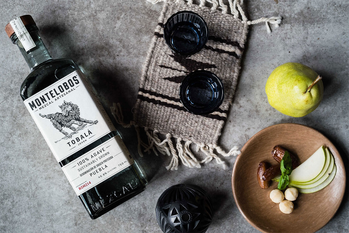 Montelobos Tobalá, bottle, shots and bowl of garnish