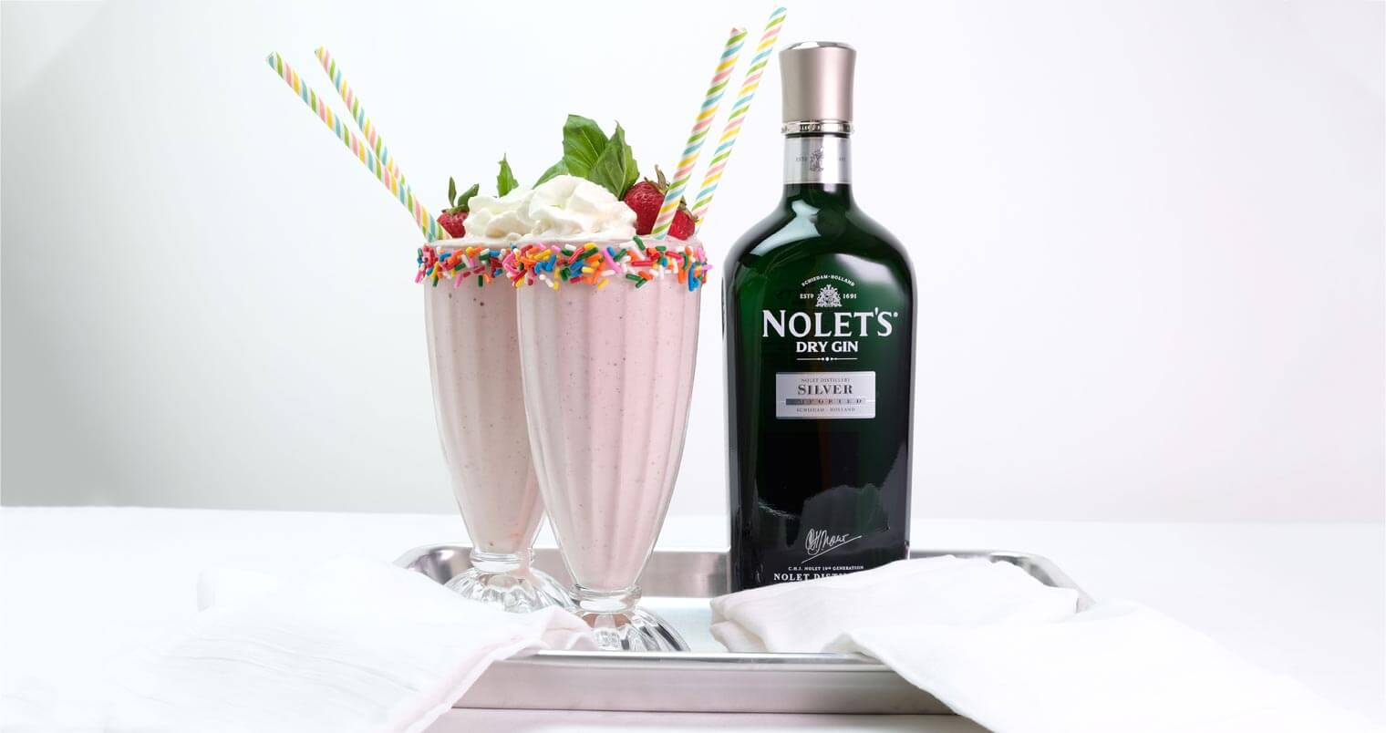 NOLET’S Spiked Strawberry Milkshake, cockails, bottle on silver tray, featured image