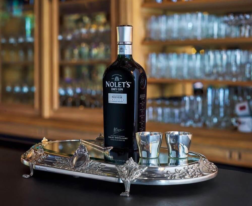 Mixing with Nolet's Gin, bottle and glasses display