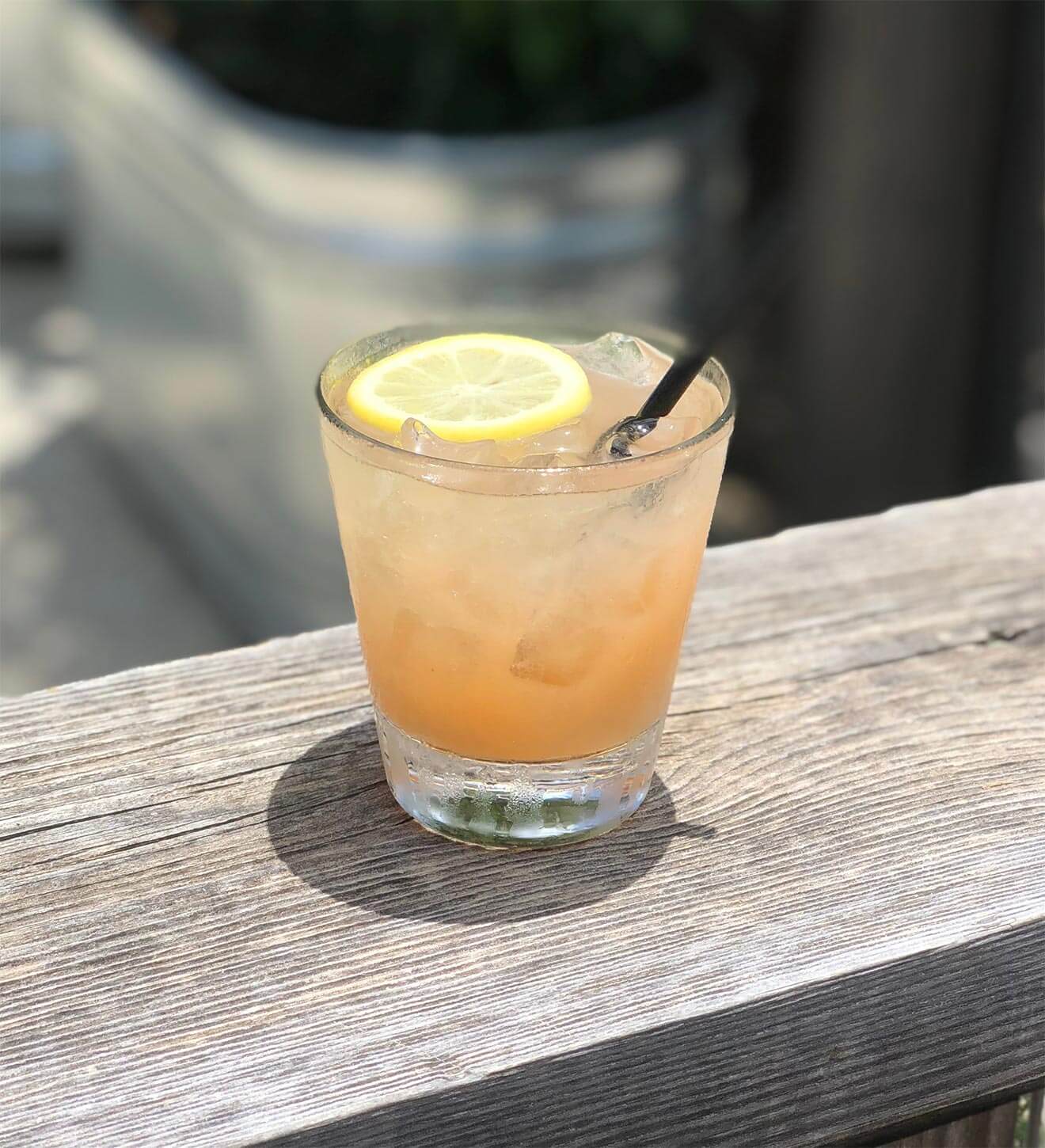 NUE Agua Fresca, cocktail with lemon wheel