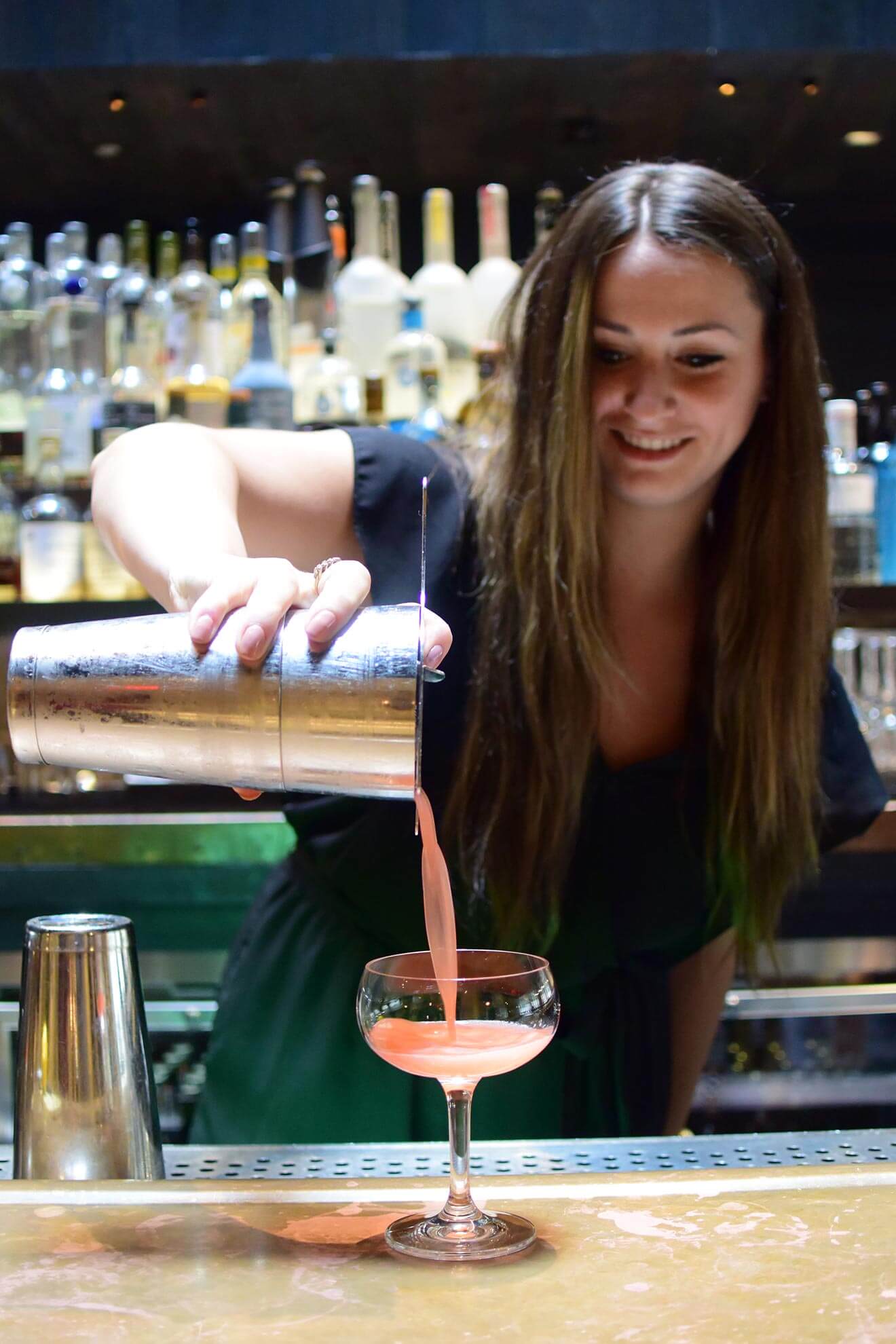 Nikki McCutcheon pouring a cocktail